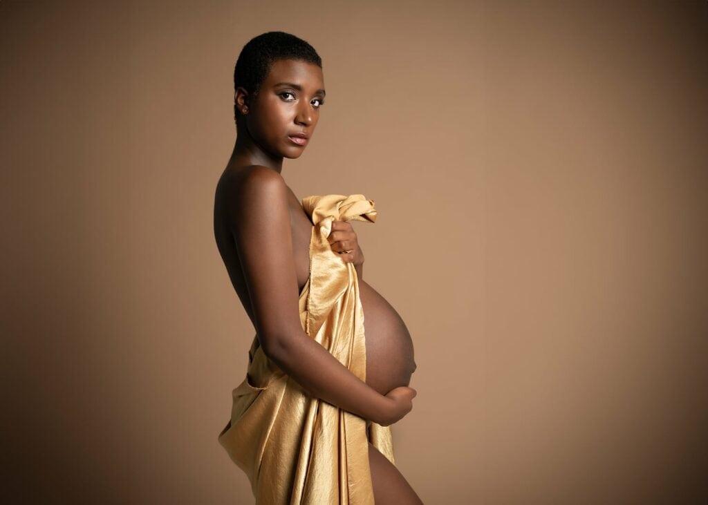 Pregnant mother in a studio-like setting.