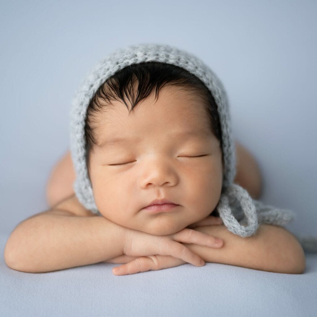 infant baby boy on blue blanket